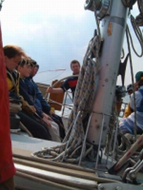 Peter McGrath on the helm of the Ocean Youth Trust North East yacht James Cook.