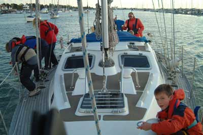 the skipper and young crew of Matriarch prepare to come alongside under Simon's guidance